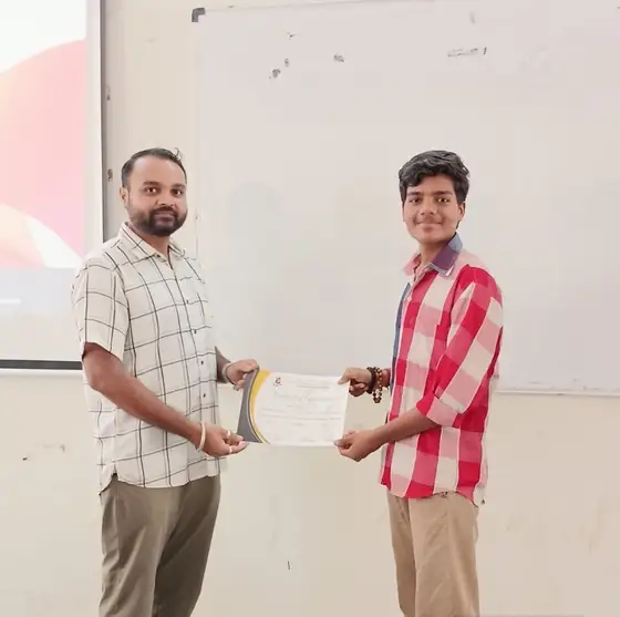 Another student receiving a certificate at the GTU ITR AI workshop