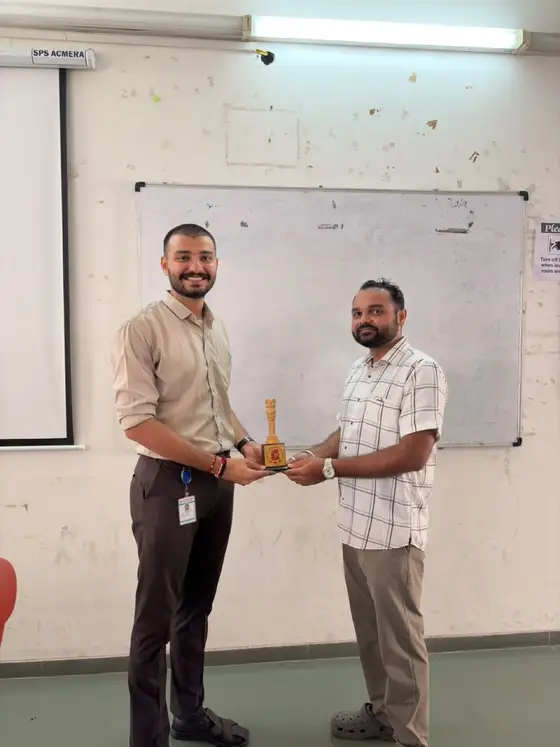 Anand receiving a memento from GTU ITR faculty