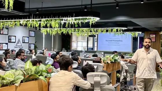 Anand walking the floor during the Beyond Prompting session at Impero