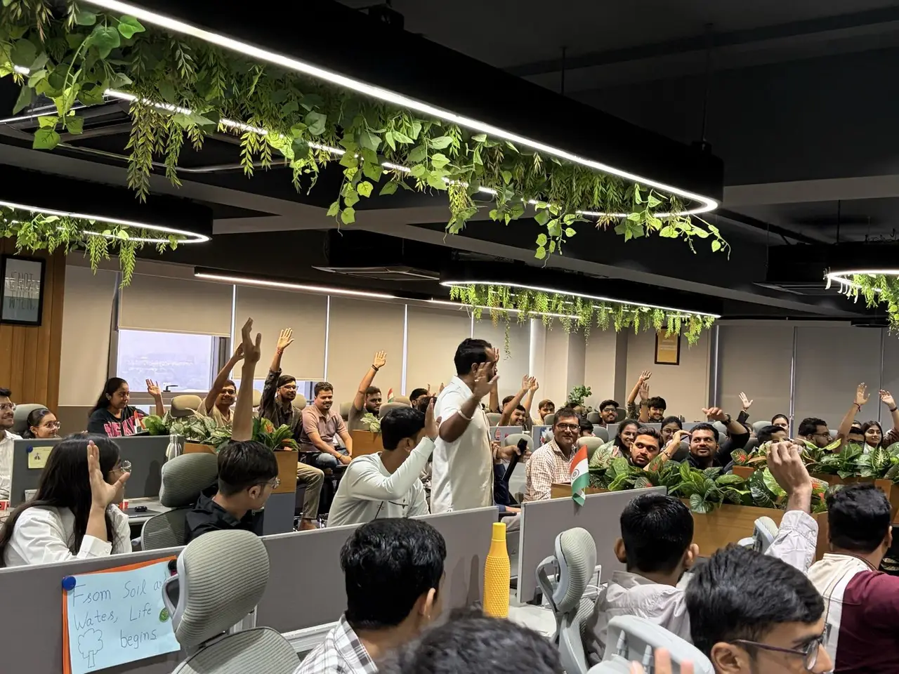 Impero IT Services employees raising hands during a corporate AI training session by Anand Shrivastava